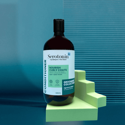 Bottle of SerotoninKC Groomers Collection Nourish Curly Coats Conditioner